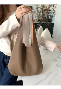 Soft leather hobo shoulder bag for women, large capacity casual daily tote bag style.