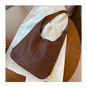 Soft leather hobo shoulder bag detail, minimalist slouchy large capacity design for women.