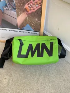 Trendy green crossbody shoulder bag with large LMN letters, waterproof casual pillow bag.