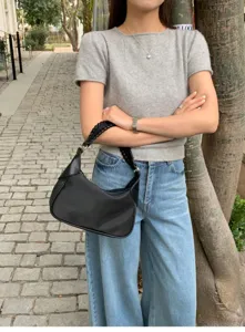Minimalist black shoulder bag with braided handle, chic faux leather hobo purse for women daily style.