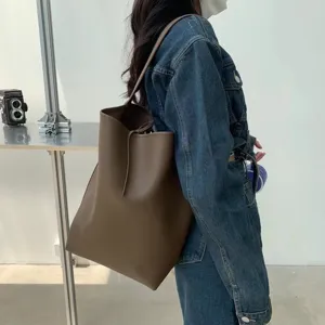 Stylish brown PU leather tote bag, minimalist large capacity shoulder bucket bag for daily wear.