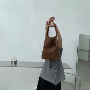 Stylish brown PU leather shoulder bucket bag for women, large capacity minimalist tote bag.