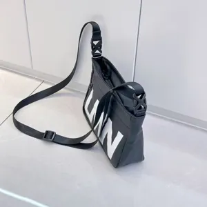 Black waterproof crossbody bag with large letter print, adjustable strap, casual style.