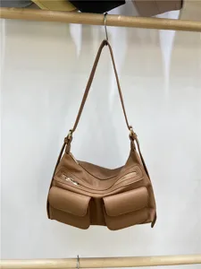 Brown leather motorcycle shoulder bag with multi-pockets and zippers, detailed close-up shot.