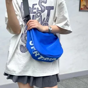 Casual blue crescent shoulder bag for women, stylish nylon dumpling crossbody bag for daily travel.