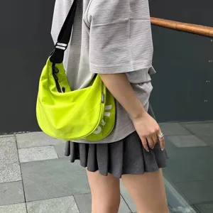 Canvas crescent crossbody bag for women and men, stylish neon green dumpling shoulder bag.