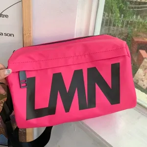Pink waterproof shoulder bag with large letters, casual crossbody pillow bag for women.