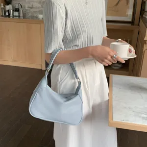 Minimalist blue shoulder handbag with braided strap, casual stylish hobo bag for women.