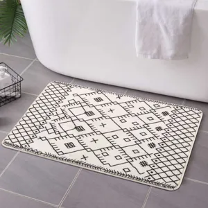 Close-up of the Nordic Moroccan geometric black and white floor mat in a clean bathroom.