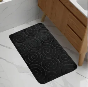 Black flannel swirl bath mat, absorbent non-slip floor mat for bathroom and toilet use.