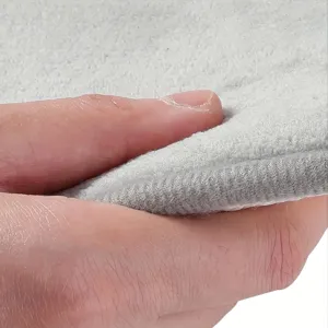 Close-up view of grey memory foam mat surface texture and edge stitching detail.