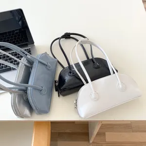 Chic minimalist underarm shoulder bag, stylish long-handle retro baguette handbag for women.
