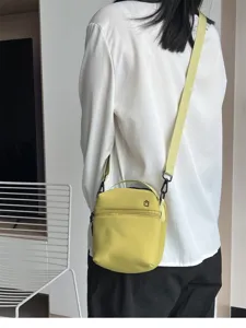 Lightweight small crossbody phone bag with zipper, casual stylish yellow shoulder bag.