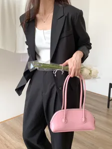Pink underarm shoulder bag, trendy niche design shell handbag, retro baguette style for women.