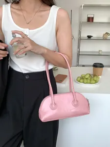 Pink leather underarm shoulder bag, trendy minimalist long handle baguette handbag for women.