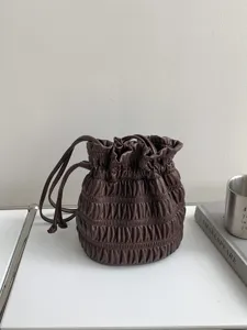 Brown pleated drawstring bucket bag, Korean vintage style handbag for women summer new detail.