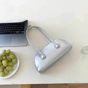 Silver baguette shoulder bag detail, stylish niche design long handle shell handbag for women.