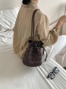 Korean retro pleated drawstring shoulder bag, stylish dark brown PU leather bucket bag for women.