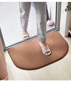Absorbent non-slip semicircle floor mat for bathroom bedroom doorway use, soft brown rug.