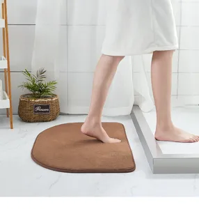 Absorbent brown bathroom floor mat detail showing soft texture and anti slip backing.