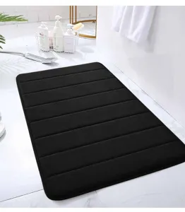 Black memory foam bath mat with striped design, anti-slip and absorbent for bathroom floor.