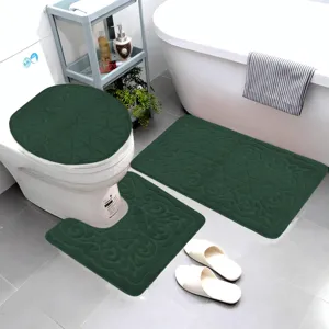 Dark green flannel embossed bathroom mat set, anti-slip toilet lid cover and absorbent floor rugs.