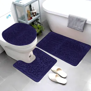 Detailed view of dark blue flannel embossed bathroom mat set, soft absorbent non-slip rugs.