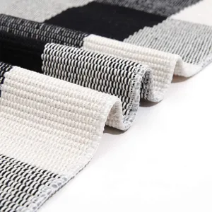 Modern black and white plaid cotton linen floor mat, hand-woven area rug for home decor.