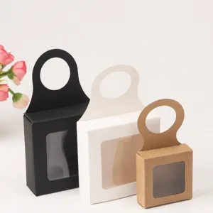 Small kraft paper packaging box with hanging ear and clear window for tea coffee gifts.