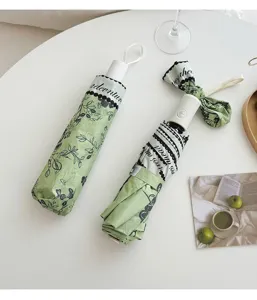 Fresh floral folding umbrella with UV protection, portable compact sun and rain umbrella for daily use.