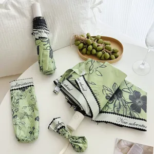 Compact UV protection folding umbrella with elegant green botanical oil painting print and pouch.