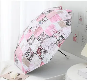 Automatic folding sun umbrella with stylish newspaper print design, UV protection and black glue.