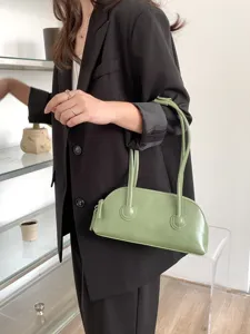 Light green underarm shoulder bag baguette purse with dual top handles for daily wear.