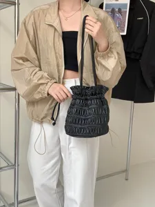 Stylish black pleated drawstring bucket bag for women, perfect for summer casual daily use.