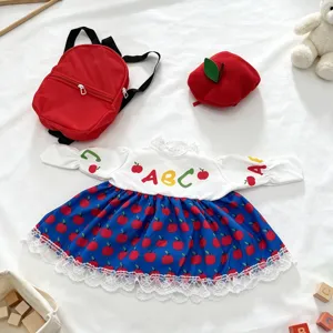 Cute 23-inch goose doll outfit set featuring a red apple print dress, mini backpack, and hat.