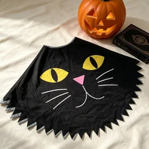 Halloween black cat cape costume party dress up cloak with cute yellow eyes and jagged hem.