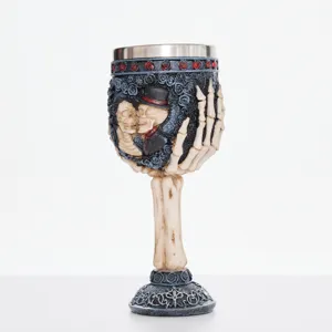 Gothic skeleton goblet detail showing resin skull couple design and stainless steel inner cup.