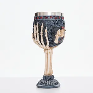Gothic skeleton hand skull goblet detail view, resin and stainless steel red wine cup.