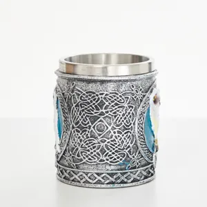 Stainless steel inner resin mug detail showing intricate Celtic knotwork and carved owl motifs.