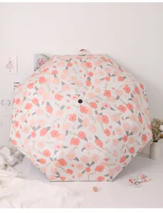 Blumiger Taschenschirm mit UV-Schutz, kompakter regendichter Sonnenschirm für Damen im Alltag.