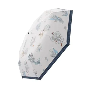 Parapluie pliant automatique avec protection UV, pare-soleil noir et motif de fleurs.