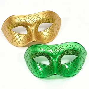Set of two decorative glitter masquerade half face masks in gold and green for parties.