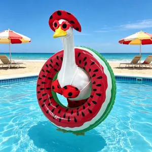 Porch goose decorative figurine wearing a cute watermelon swimsuit and floatie for outdoor setup.