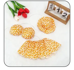 Yellow animal print swimsuit set for 23-inch yard goose statue, summer porch outfit detail.