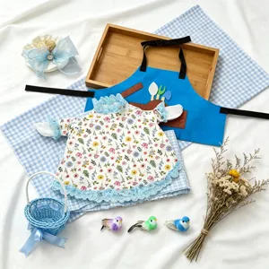 Summer pastoral style 23-inch goose doll clothes set with floral dress and blue apron accessories.