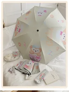 Paraguas plegable con estampado de dibujos animados y protección UV, sombrilla automática compacta.