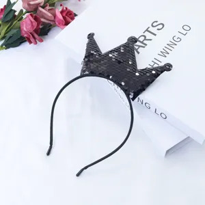 Close-up detail of a black sequin crown headband, perfect for kids party and performance.