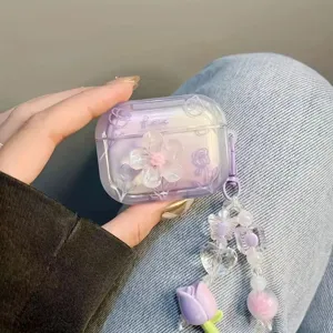 Detail view of purple gradient AirPods Pro case with 3D flower and tulip bead charm