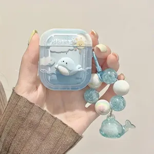 Cute 3D seal AirPods case in translucent blue with a beaded whale charm accessory