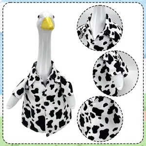 Resin goose garden statue wearing a stylish black and white cow print shirt for yard decor